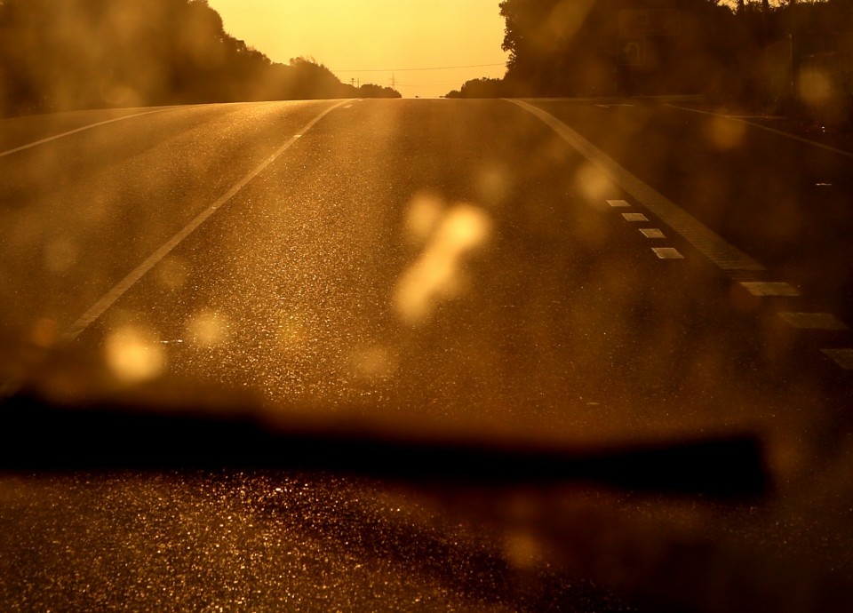 road through dirty window