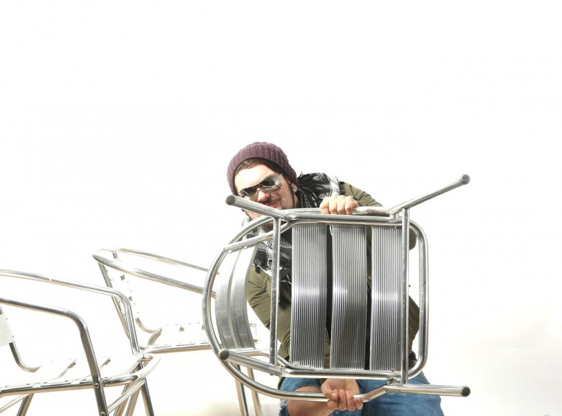 man with metal chair