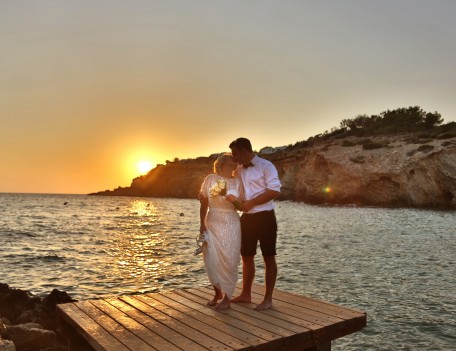 wedding couple kiss by sea - Elixir Shore Club