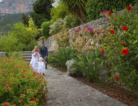 bride, groom and daughter in garden - Son Berga