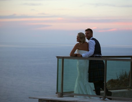 bride and groom on balcony - The Jumeirah Hotel