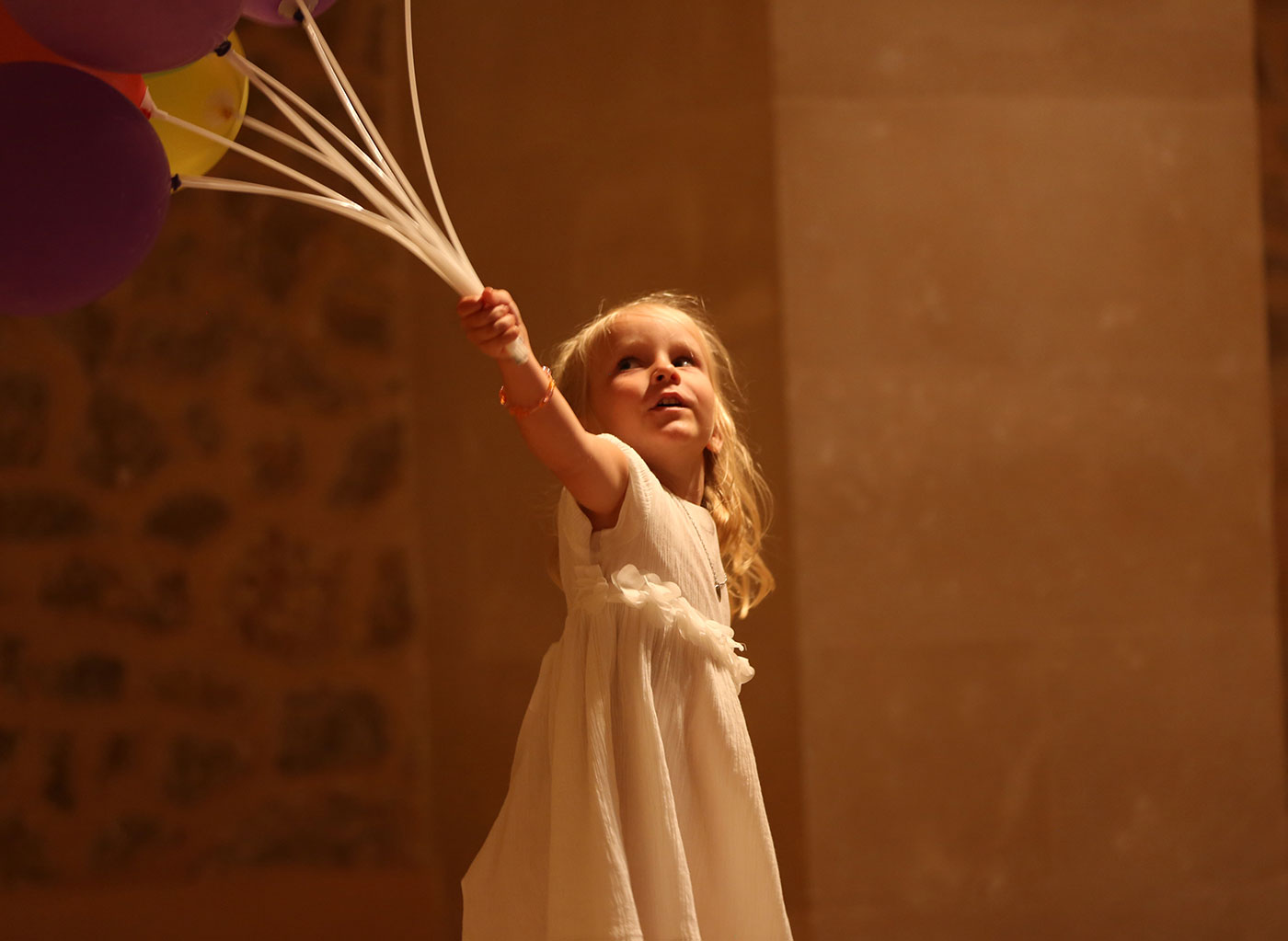 child with balloons