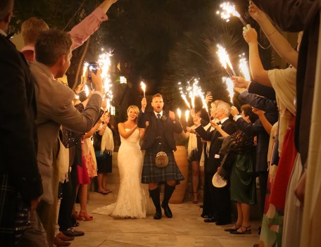 wedding couple with ceremonial flares - The Jumeirah Hotel