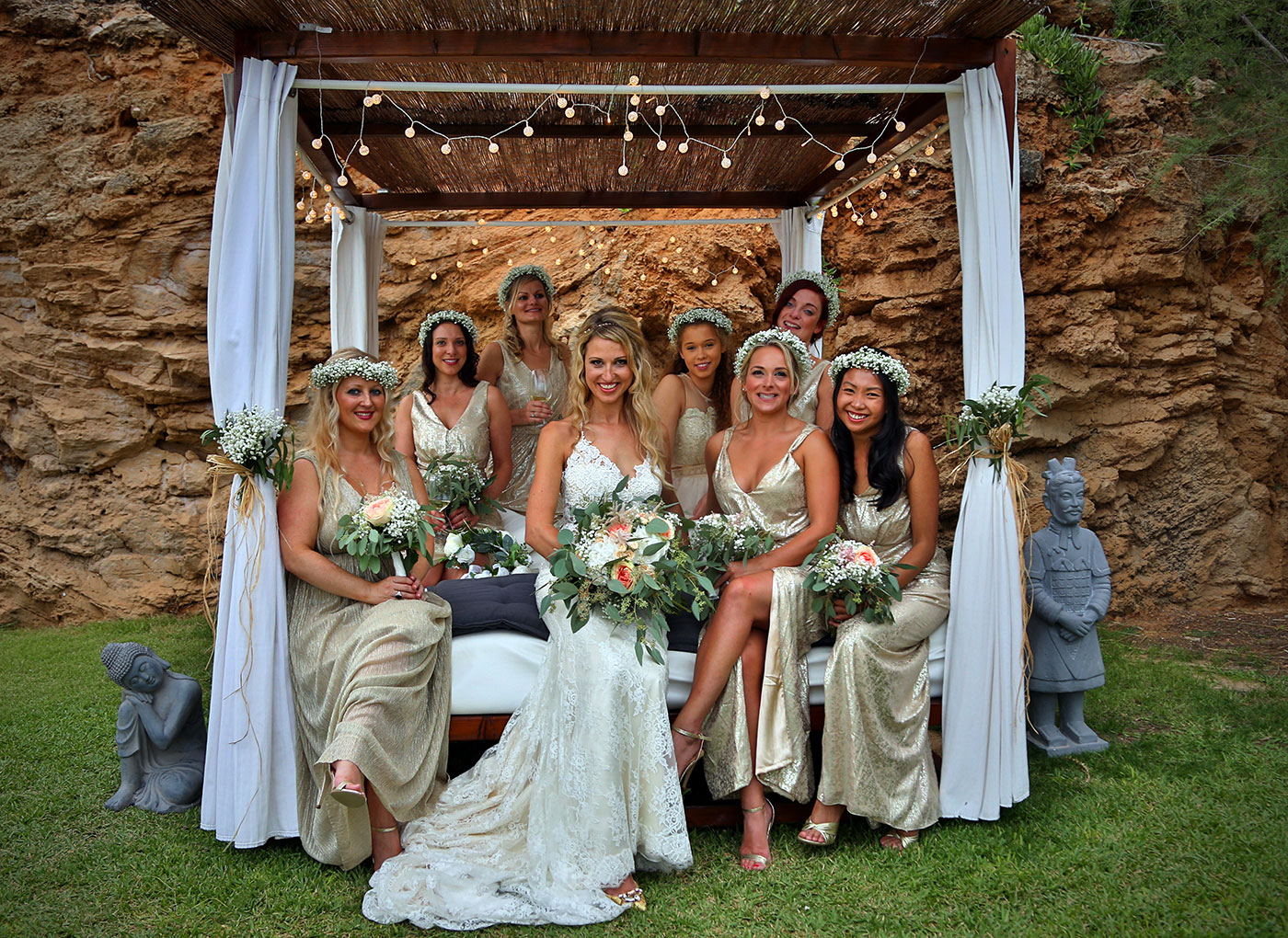 bride with bridesmaids on bed