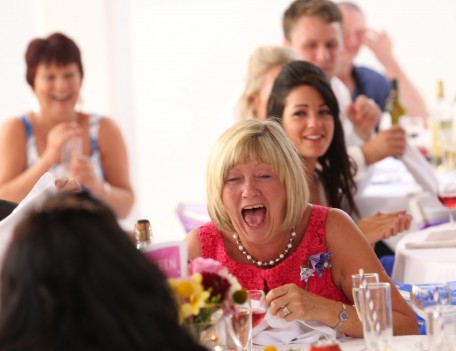 woman laughing at table - Favourite Wedding Faces