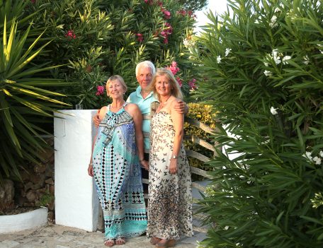 Three people by gate - Casa Merdeka Menorca