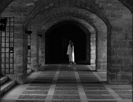 Couple under archways - Palma Engagement Shoot