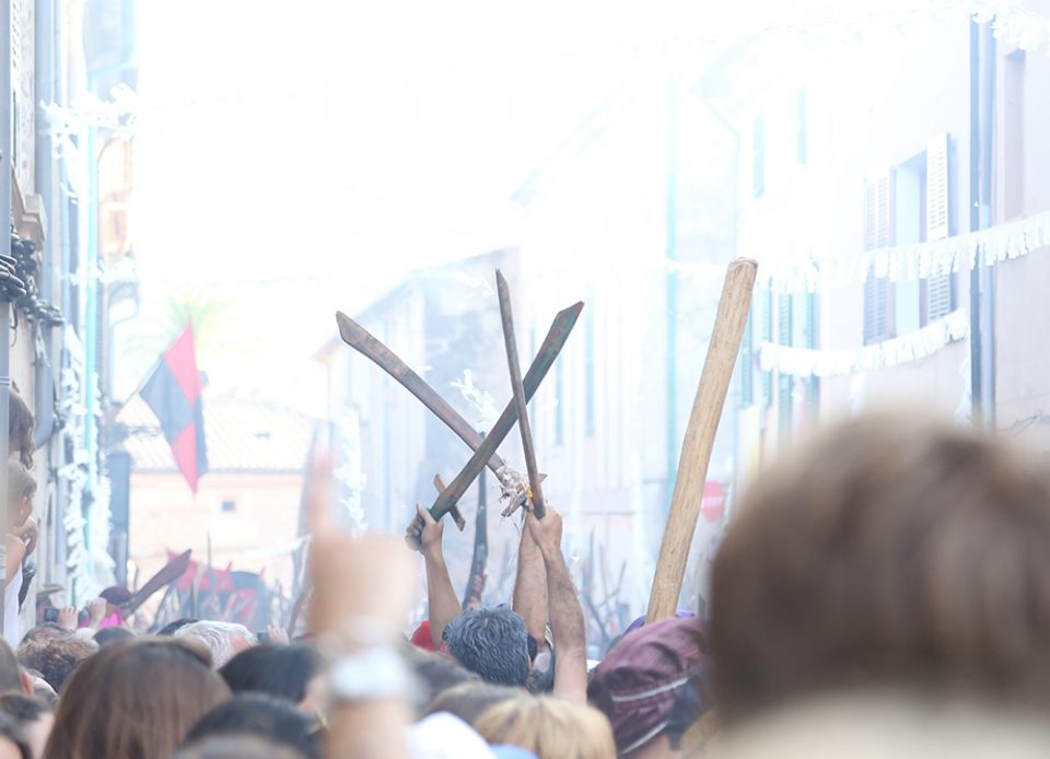 Wooden swords in crowd