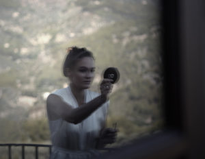 reflection of girl in glass