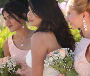 three girls in wedding dresses