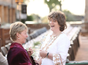 two women by dinner table