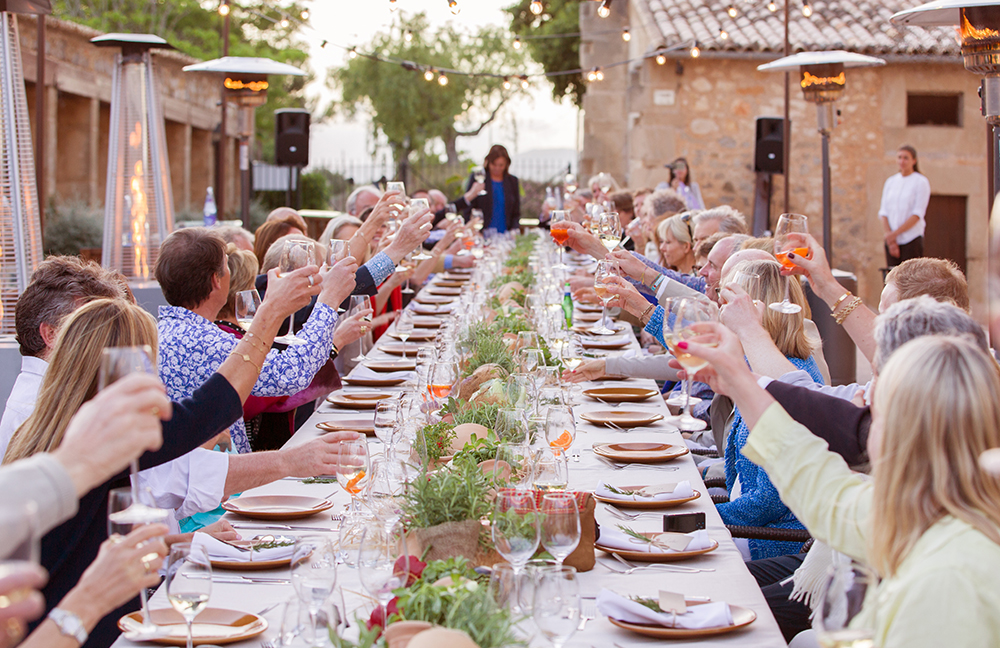 raised glasses at table