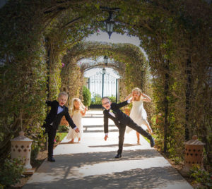 children at wedding in garden tunnel