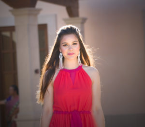 girl in red dress smiling