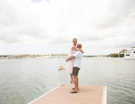 man holding woman aloft - Casa Venecia Anniversary