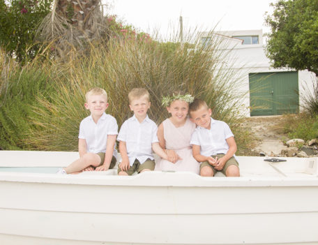 four kids sat in a small boat - Casa Venecia Anniversary