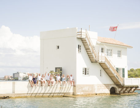 adults sit on wall near villa - Casa Venecia Anniversary