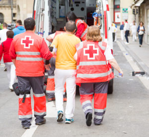 medics help injured man