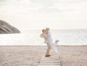 couple embrace on beach