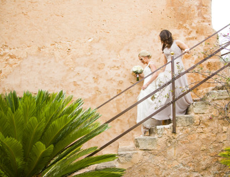 bride with bridesmaid walking down steps - Son Mir