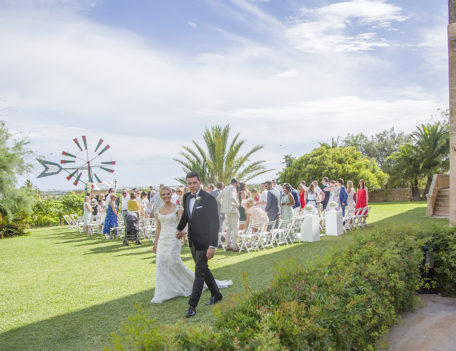 bride and groom walk from ceremony - Son Mir