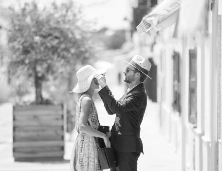 man puts hat on woman - Hotel Sant Joan de Binissaida