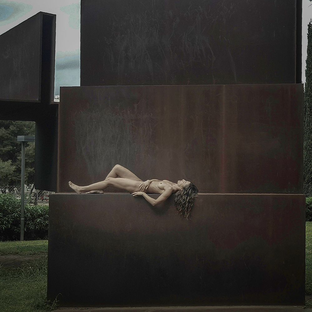 Naked woman on sculpture