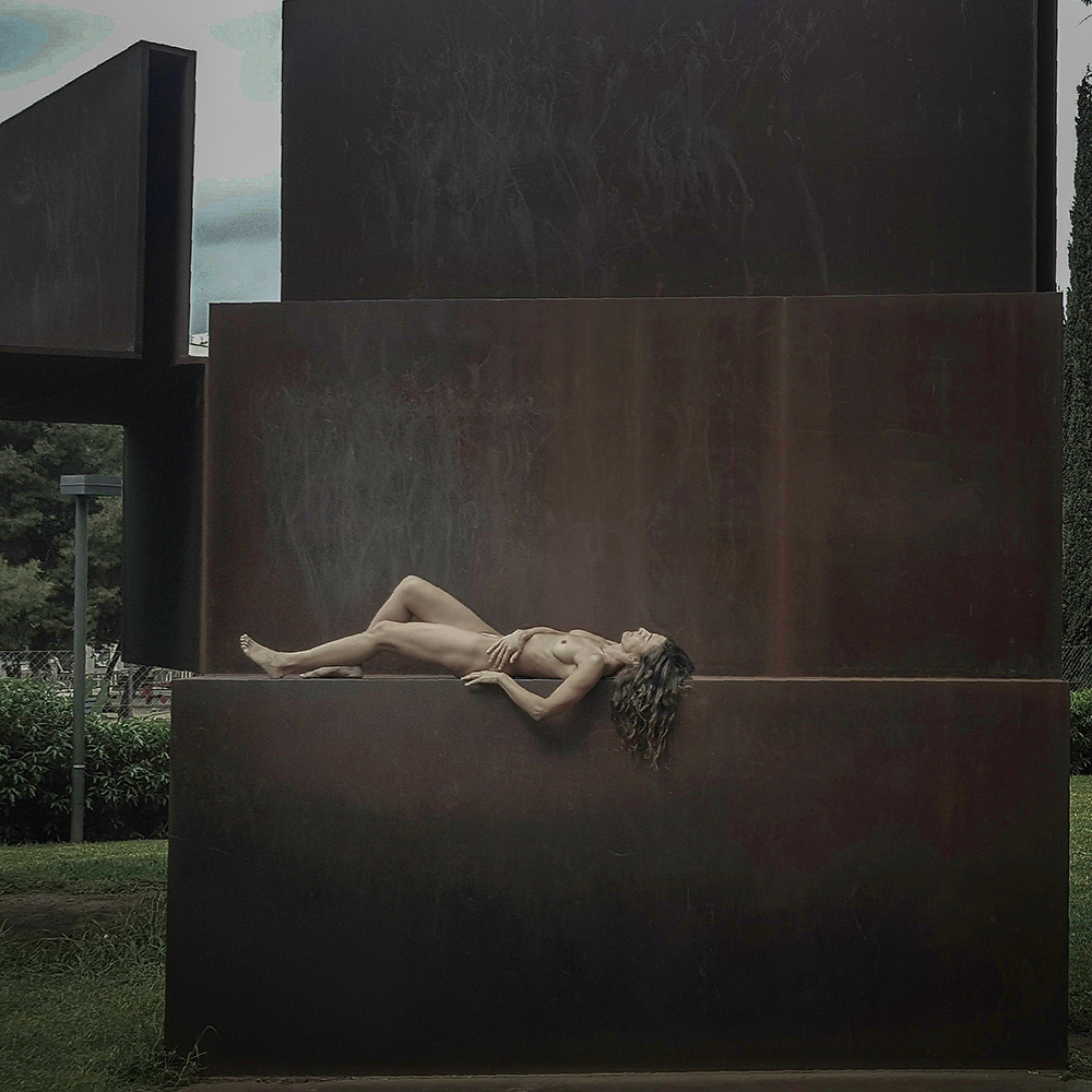 Naked woman on sculpture