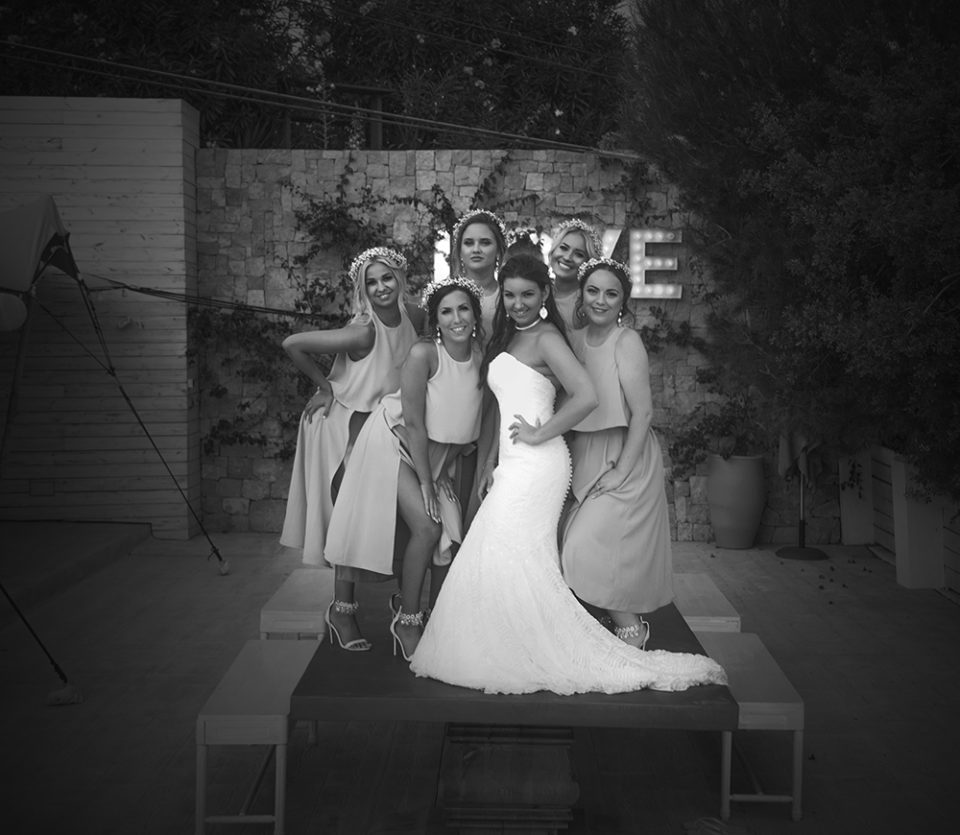 bride with bridesmaids on table
