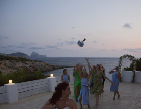bride throws the bouquet - Elixir Shore Club