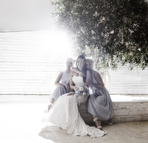 bride with friends under tree