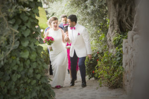 wedded couple walk up path