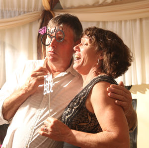 couple with photo booth props