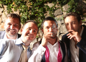 groom with friends pose for photograph