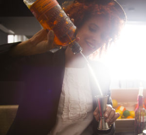 woman pouring whiskey 