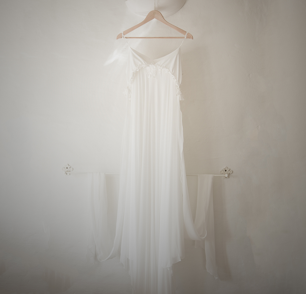 wedding dress hung on lamp shade