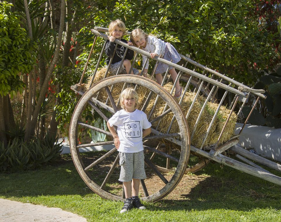 three kids on cart