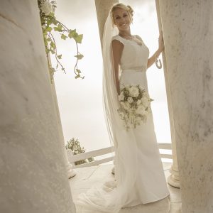 bride at the marble ceremonial columns