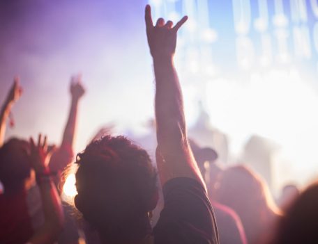 man in festival crowd with hand up - Sonar Festival