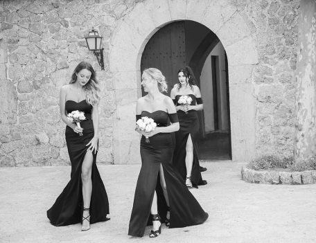 bridesmaids enter courtyard at Son Marroig - The Bride at Son Marroig