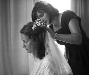 attending to the wedding veil