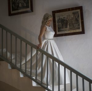 bride walks down staircase