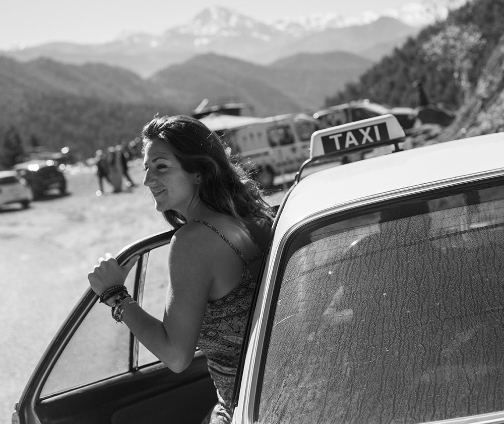 girl exiting taxi