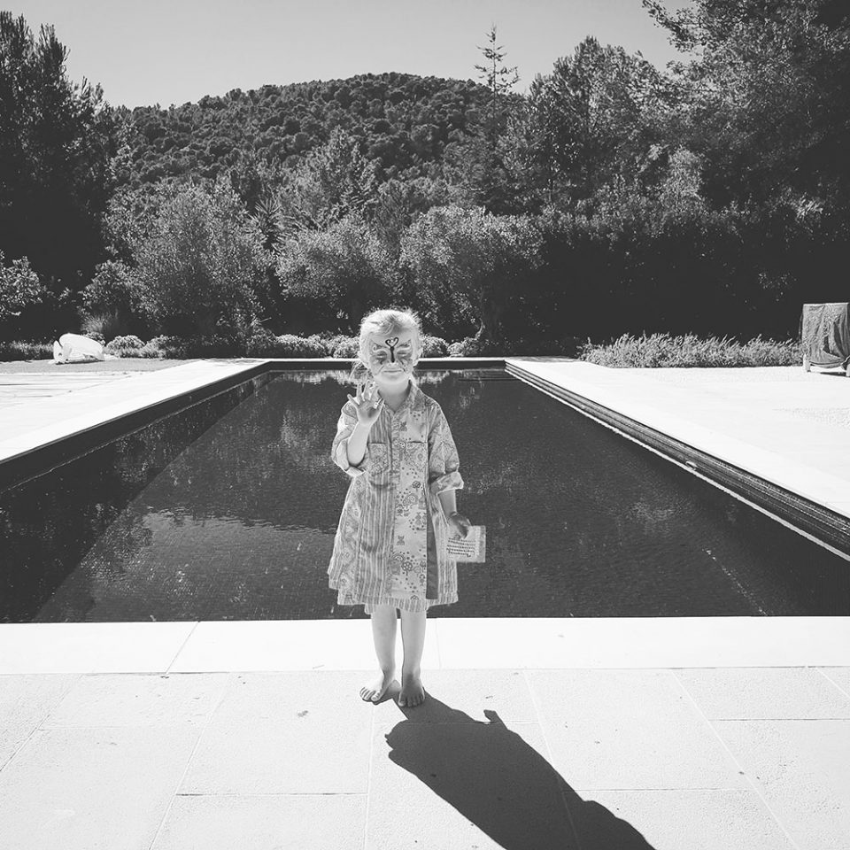 girl by swimming pool