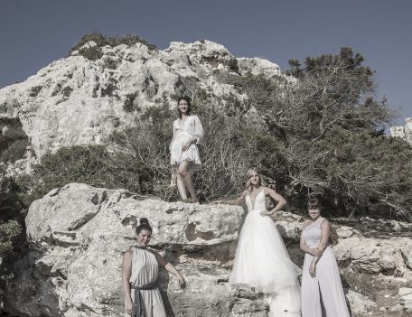 bride with friends on rock for wedding photograph - Villa Binisegarra