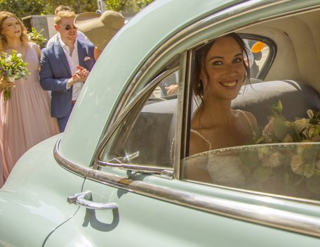 Bride in wedding car - Dalt Des Coll