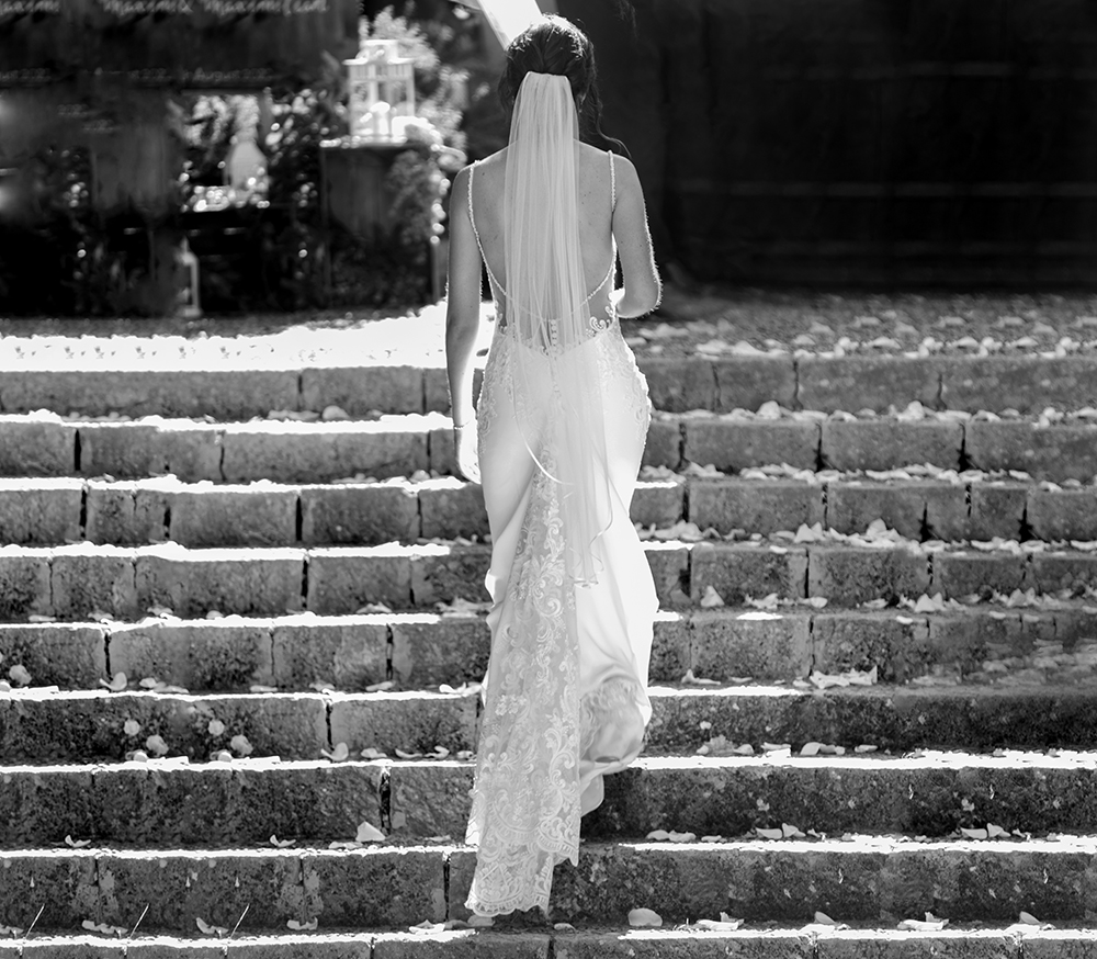 Bride walking up steps