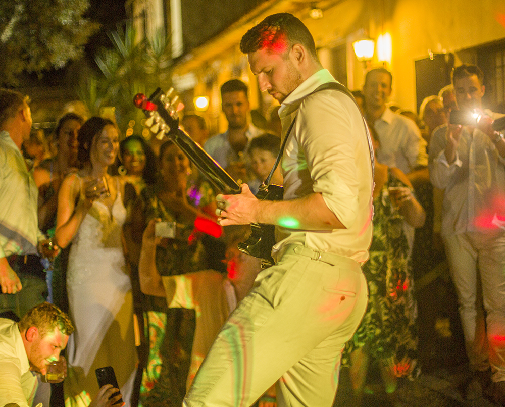 Groom playing guitar